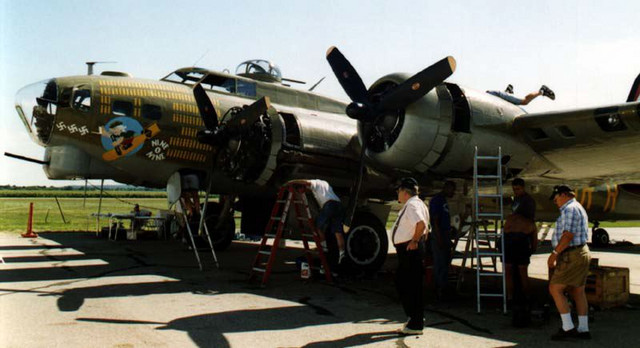 I helped their maintenance crew change the turbo-supercharger on engine number one while we were on the ground in Janesville, WI.  The legs sticking out the top of the engine nacelle are mine.