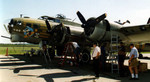I helped their maintenance crew change the turbo-supercharger on engine number one while we were on the ground in Janesville, WI.  The legs sticking out the top of the engine nacelle are mine.