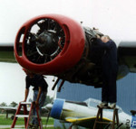 The propeller is removed.  Now we're working on the oil tank and other engine accessories.