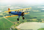 The museum's Boeing PT-17 Stearman biplane.  Stearman's were used as primary trainers during WWII.  They are an awesome airplane to fly.  I took this picture from the musuem's other Stearman.  If you look closely, you'll notice that my twin brother is in the front seat of this one.