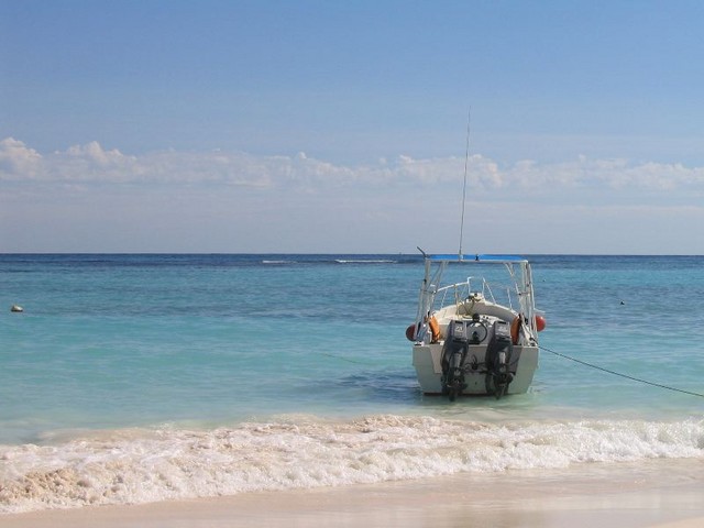 Dive boat in the surf.