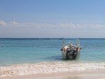 Dive boat in the surf.