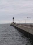 The North Pier Light at the Duluth Harbor Entrance.  This cast iron tower displays a flashing red light.