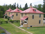 The keeper's residences.  Split Rock had three keepers and each had his own house.  The head keeper's house has been restored and is open for tours.  The other two houses are lived in by the staff that now maintain the lighthouse.