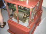 The original clockworks of Split Rock.  In most lighthouses this has been replaced with an electric motor.  The clockworks is like a giant grandfather clock or cuckoo clock.  It is used to rotate the lens of the lighthouse.  When the clockworks is wound up, the weight is at the top of the tower.  When the lens begins spinning, the counterweight slowly falls down a metal tube in the center of the tower.  When it gets to the bottom, the clockworks has to be wound up again.