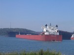 The MV Edgar B. Speer backs out of the ore dock in Two Harbors, MN.